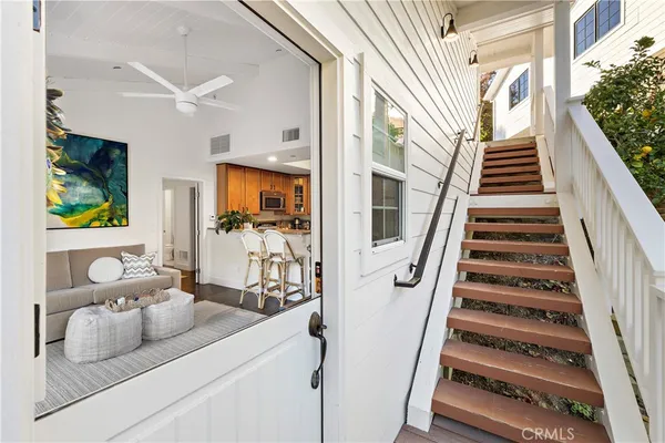 a view of living room with furniture and stairs