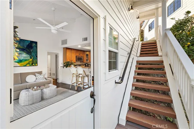 a view of living room with furniture and stairs