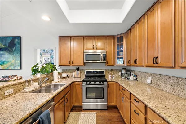 a kitchen with a stove a sink and a microwave