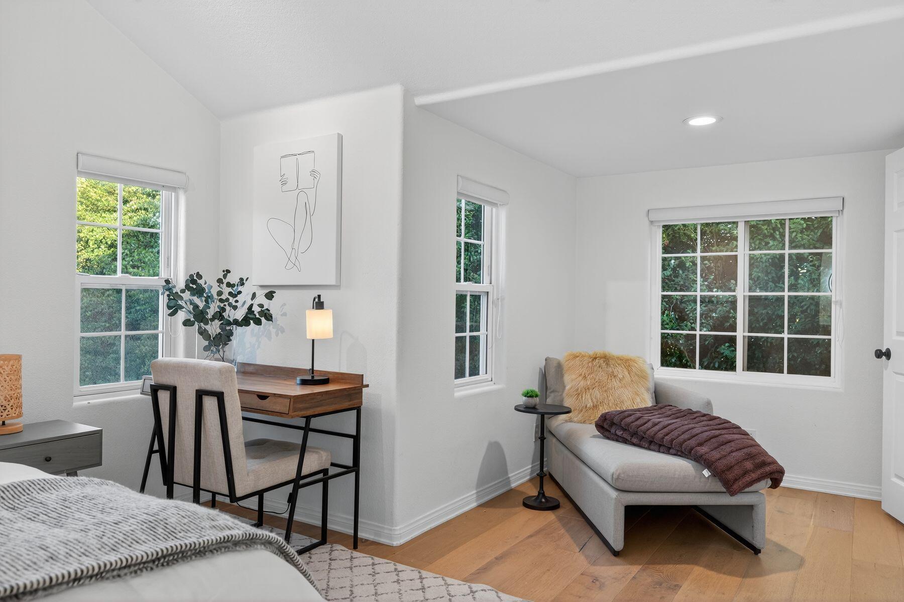 4731 4th Street Carpinteria, CA 93013 - Photo 14 of 30 a bedroom with a bed and wooden floor