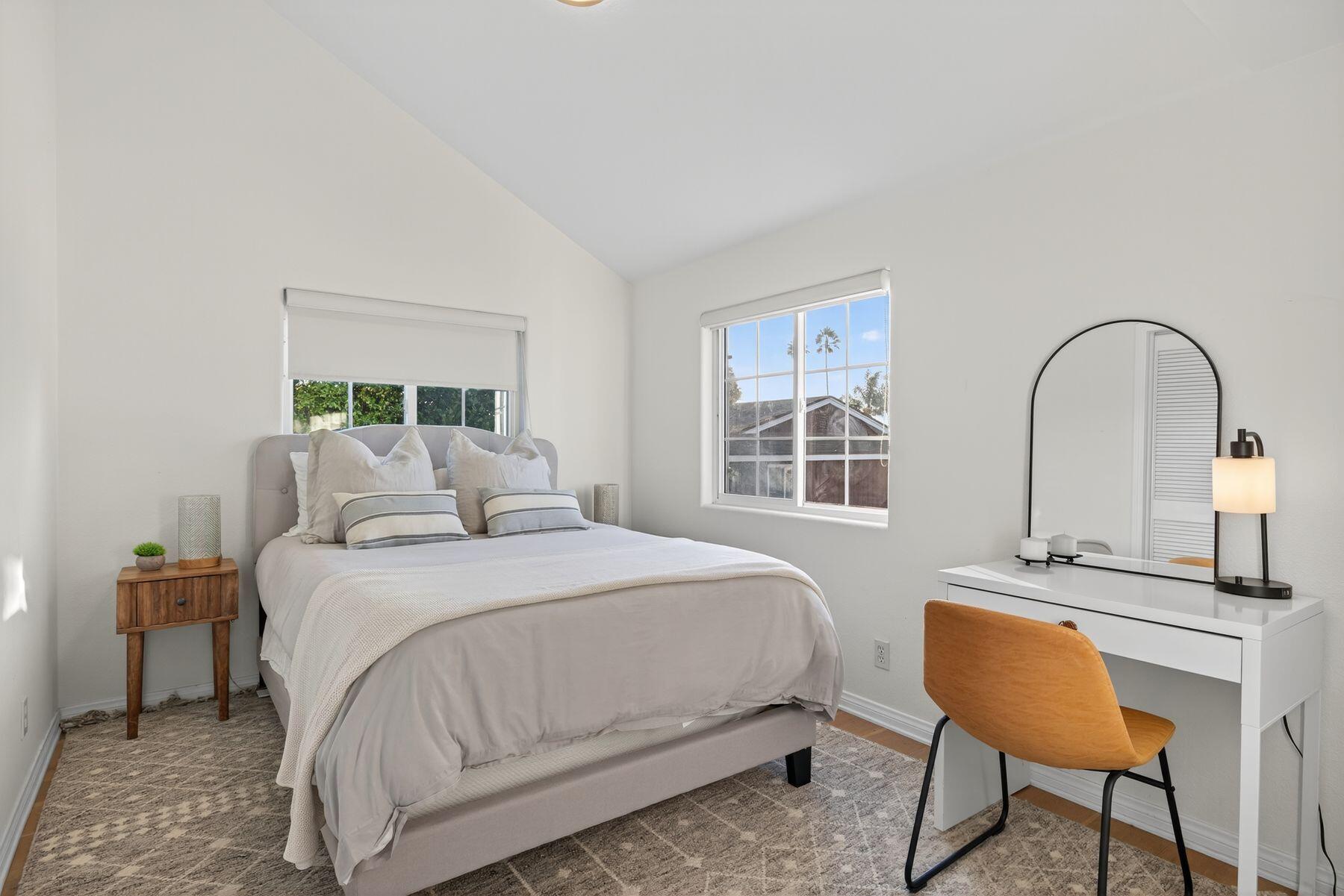 4731 4th Street Carpinteria, CA 93013 - Photo 19 of 30 a bedroom with a bed a table and chair