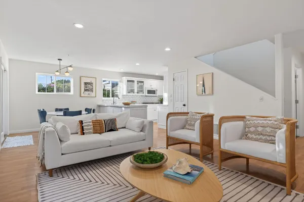 a living room with furniture and a rug