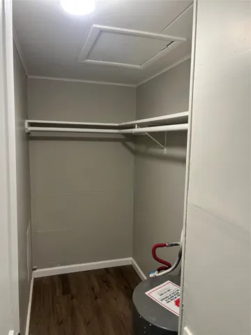 a room with a closet and wooden floor
