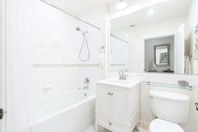 a bathroom with a sink a toilet and a bathtub