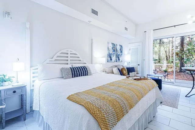 a bedroom with double bed and a window