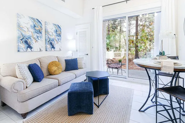 a living room with furniture and a large window