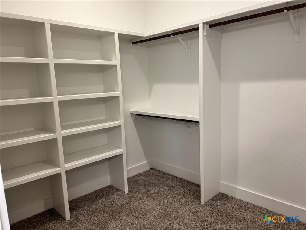 6426 Clayton Court Temple, TX 76502 - Photo 22 of 34 a view of an empty walk in closet