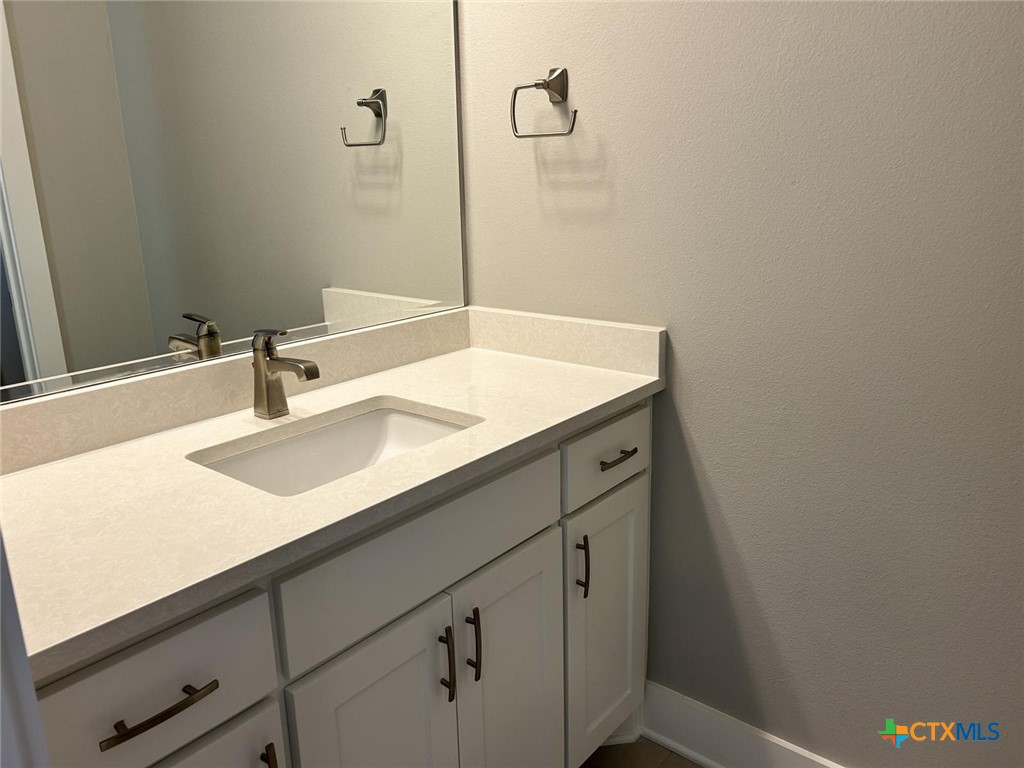 6426 Clayton Court Temple, TX 76502 - Photo 28 of 34 a bathroom with a sink and a mirror