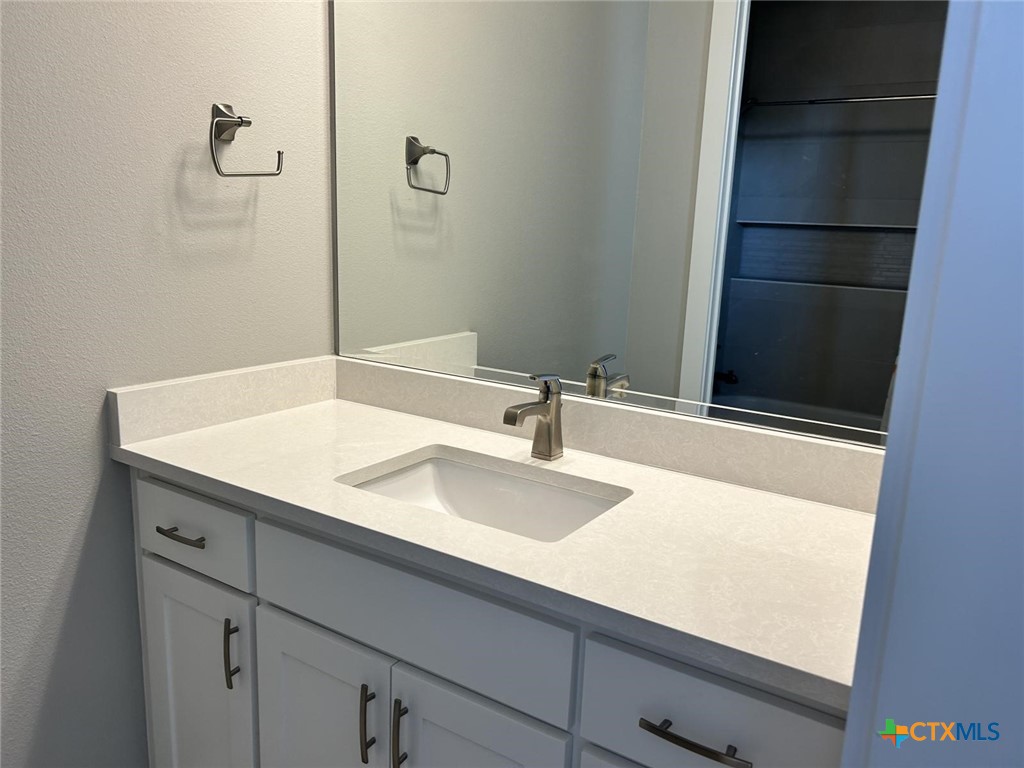 6426 Clayton Court Temple, TX 76502 - Photo 30 of 34 a bathroom with a sink and a mirror