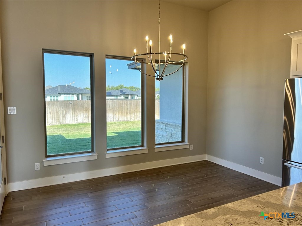 6426 Clayton Court Temple, TX 76502 - Photo 9 of 34 a view of a room with wooden floor and a window