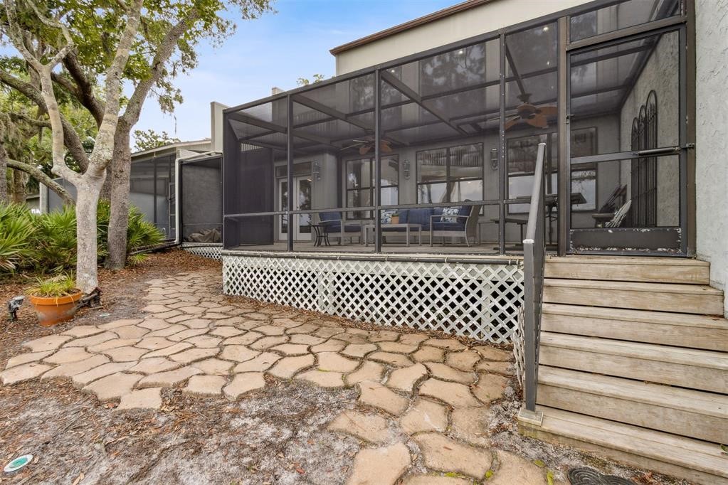 3119 Sea Marsh Road Fernandina Beach, FL 32034 - Photo 37 of 41 a view of a patio with a bench