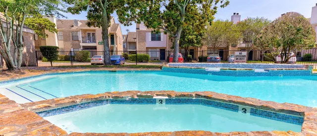 a swimming pool with outdoor seating and yard