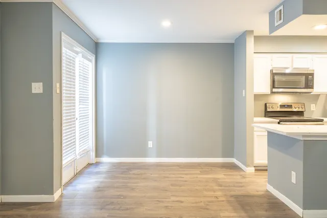 a view of a kitchen from the hallway
