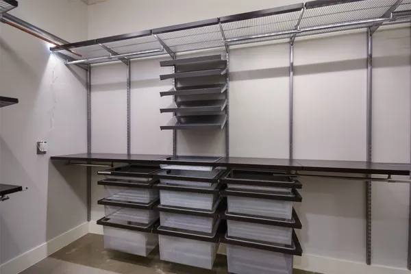 a view of a room with racks on the wall