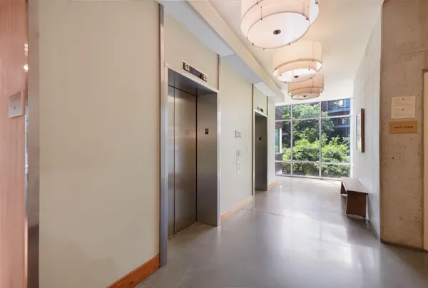 a lobby with furniture and window