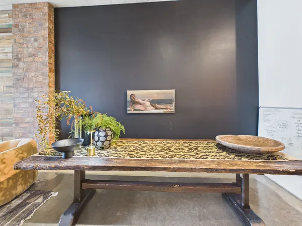 a kitchen with a table and chairs