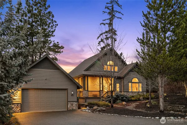 a front view of a house with a garage