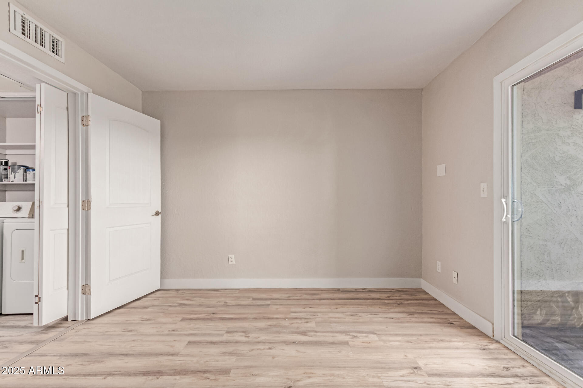 12123 West Bell Road, Unit 138 Surprise, AZ 85378 - Photo 20 of 28 a view of an empty room with wooden floor