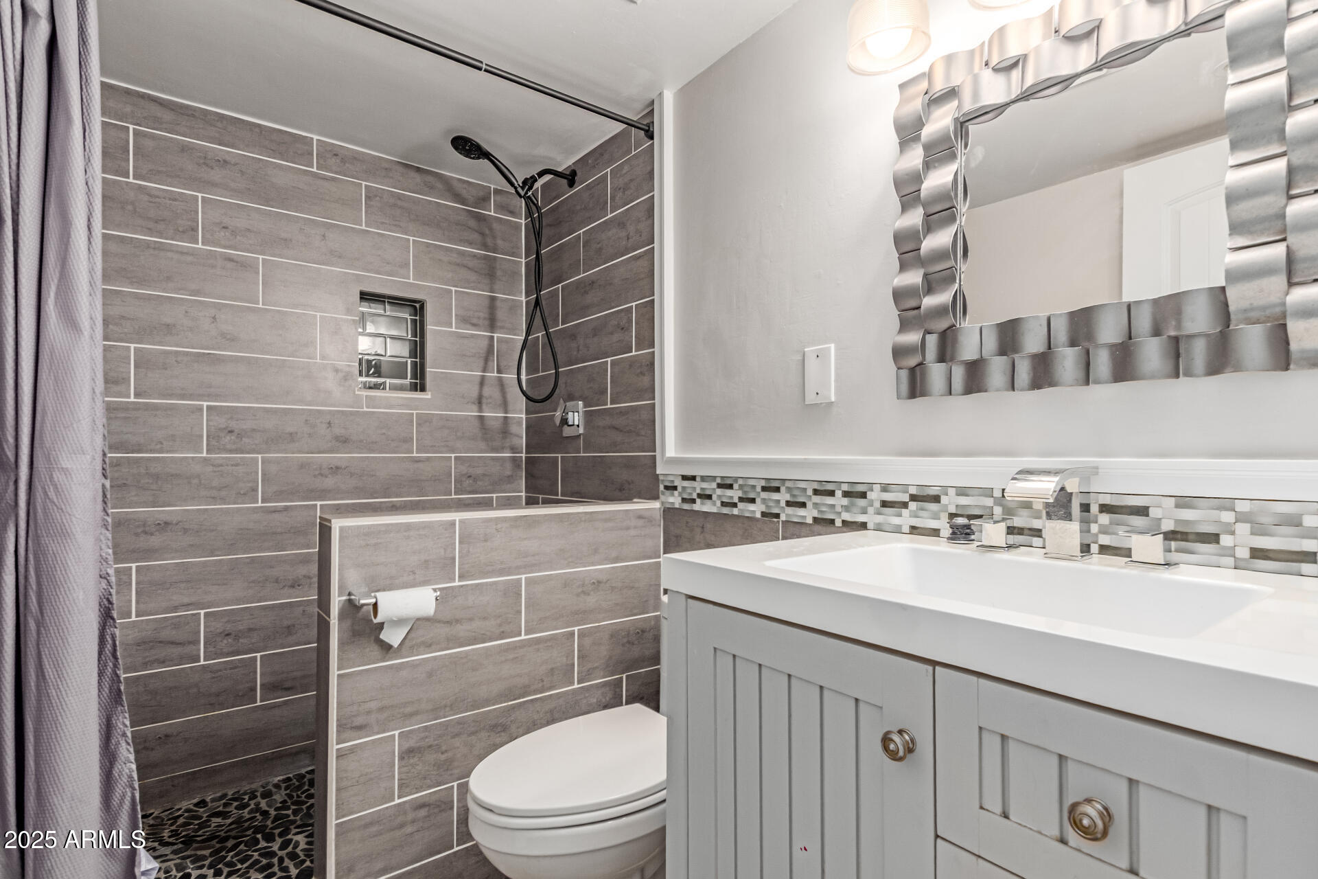 12123 West Bell Road, Unit 138 Surprise, AZ 85378 - Photo 21 of 28 a bathroom with a sink toilet and shower