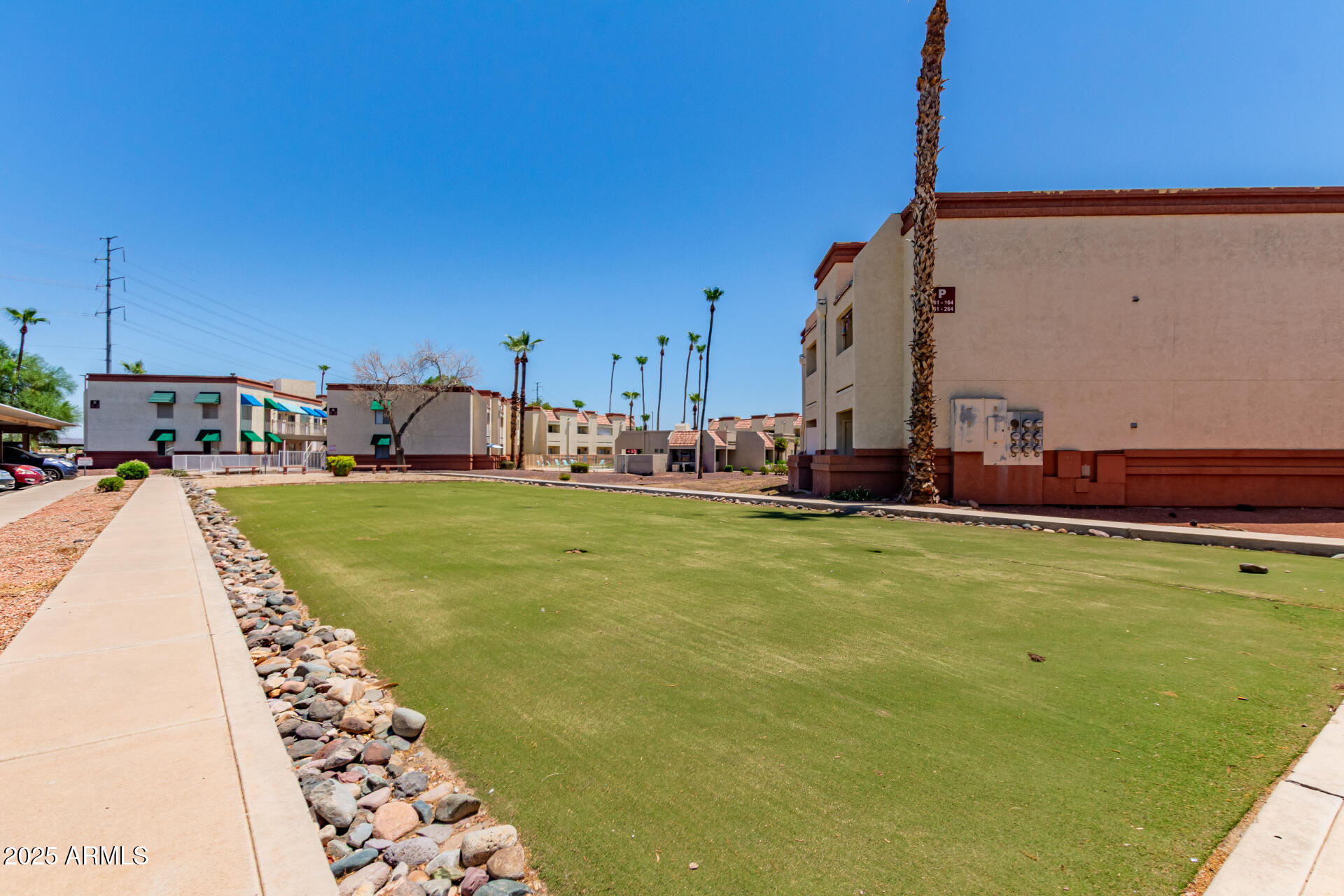 12123 West Bell Road, Unit 138 Surprise, AZ 85378 - Photo 26 of 28 a view of a swimming pool with a yard