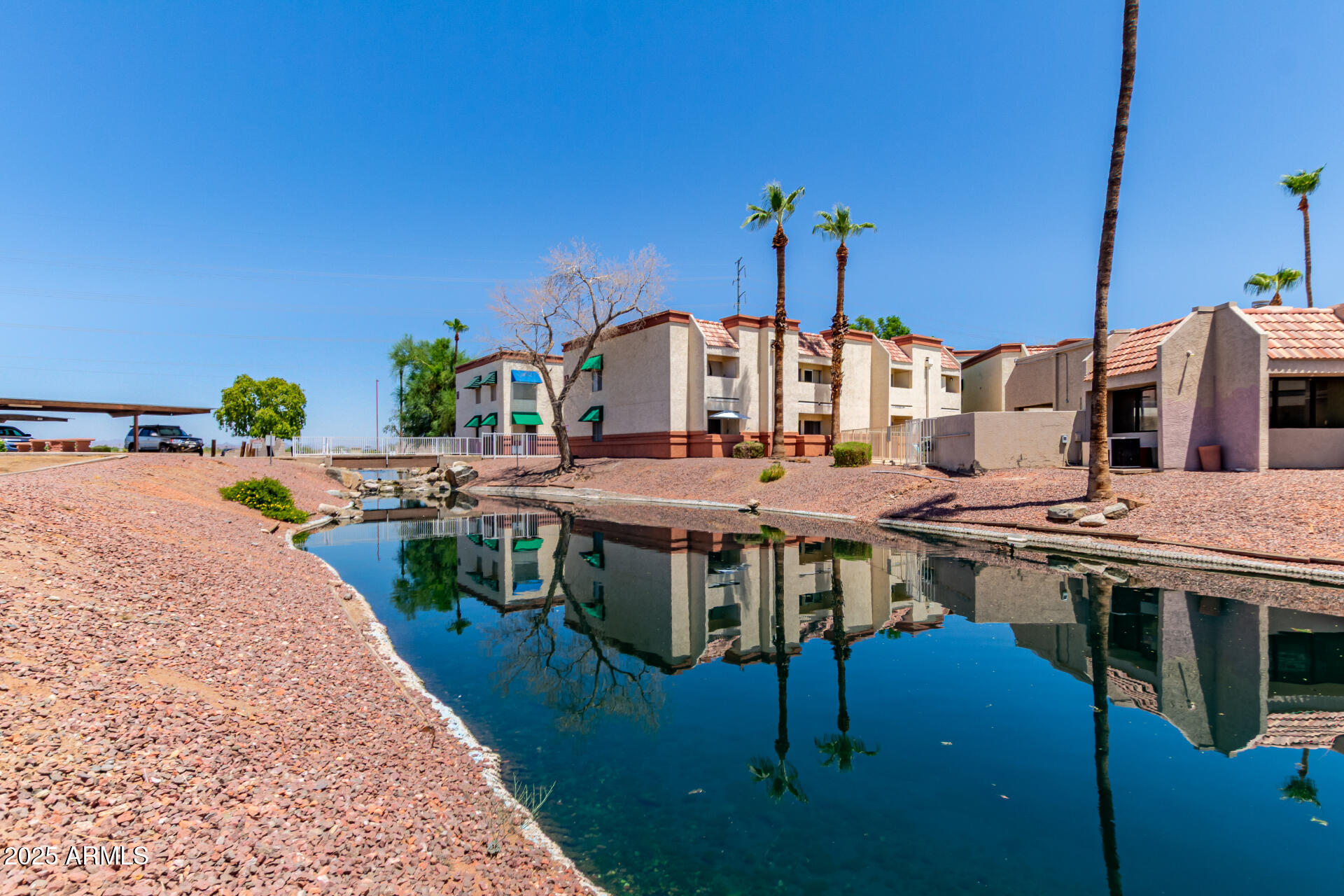 12123 West Bell Road, Unit 138 Surprise, AZ 85378 - Photo 28 of 28 a view of a patio with table and chairs