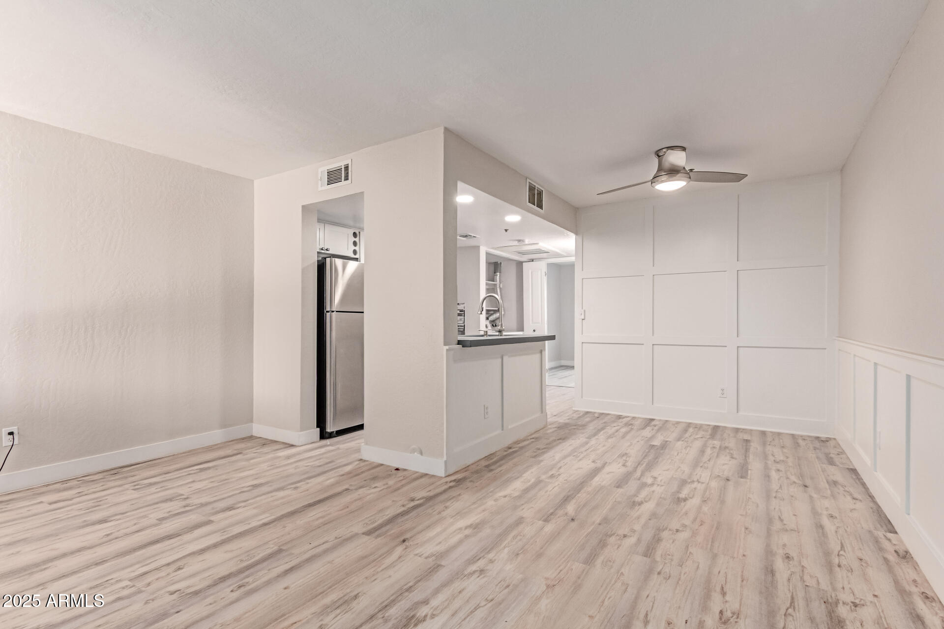 12123 West Bell Road, Unit 138 Surprise, AZ 85378 - Photo 5 of 28 a view of a kitchen with wooden floor and a sink