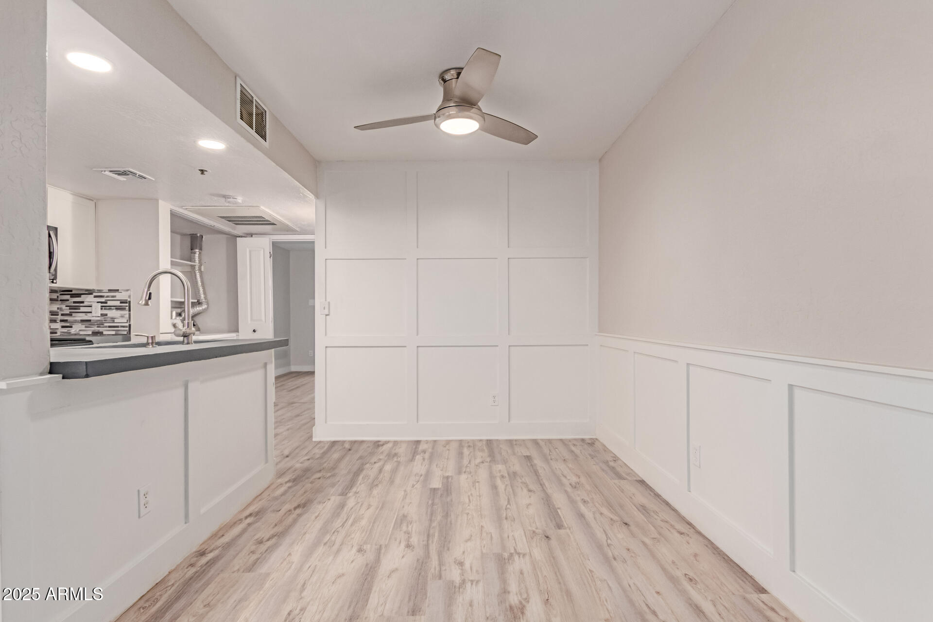 12123 West Bell Road, Unit 138 Surprise, AZ 85378 - Photo 6 of 28 a bathroom with a sink and a mirror