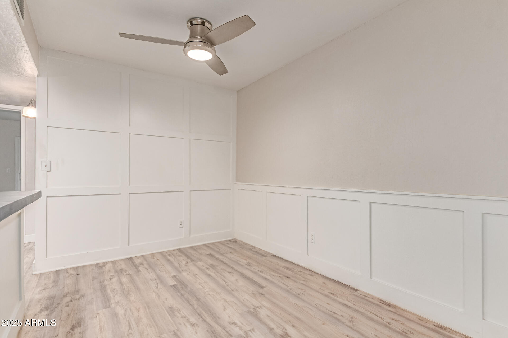 12123 West Bell Road, Unit 138 Surprise, AZ 85378 - Photo 7 of 28 a view of a room with wooden floor