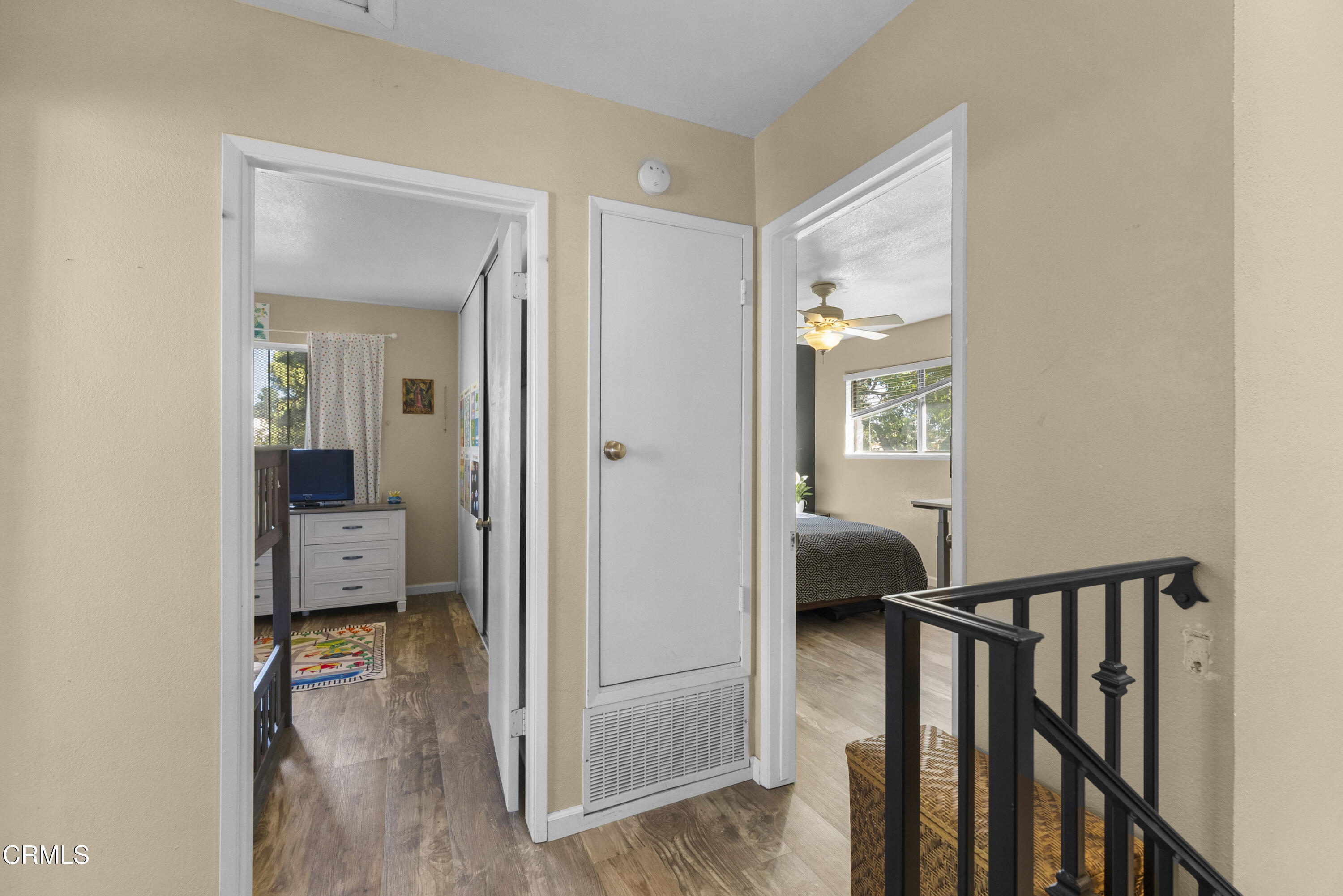 1012 Cheyenne Way Oxnard, CA 93033 - Photo 8 of 16 a view of a hallway view with wooden floor and bedroom
