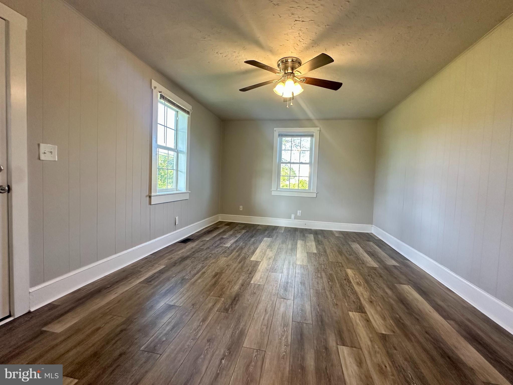 16142 Brandy Road Culpeper, VA 22701 - Photo 11 of 21 a view of an empty room with wooden floor and a window