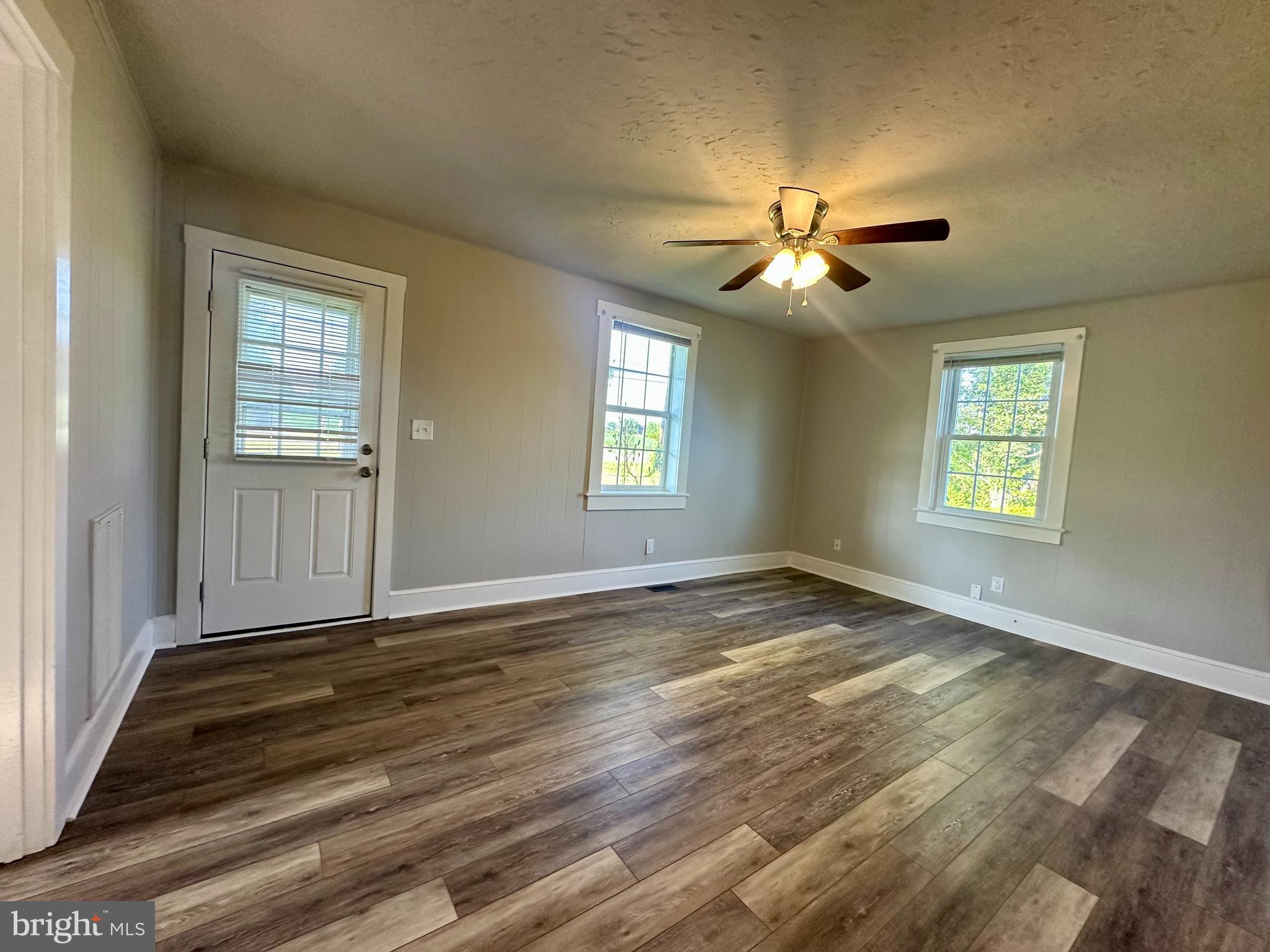 16142 Brandy Road Culpeper, VA 22701 - Photo 12 of 21 a view of an empty room and window and chandelier fan