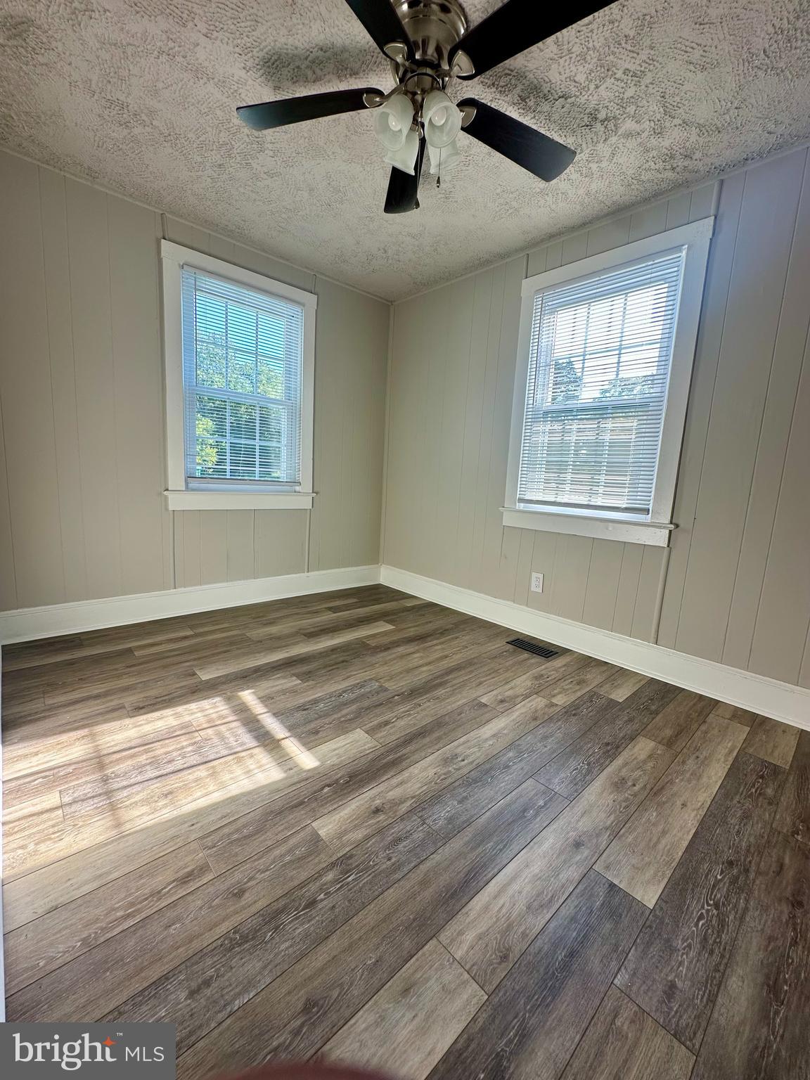 16142 Brandy Road Culpeper, VA 22701 - Photo 13 of 21 a view of an empty room with wooden floor and a window