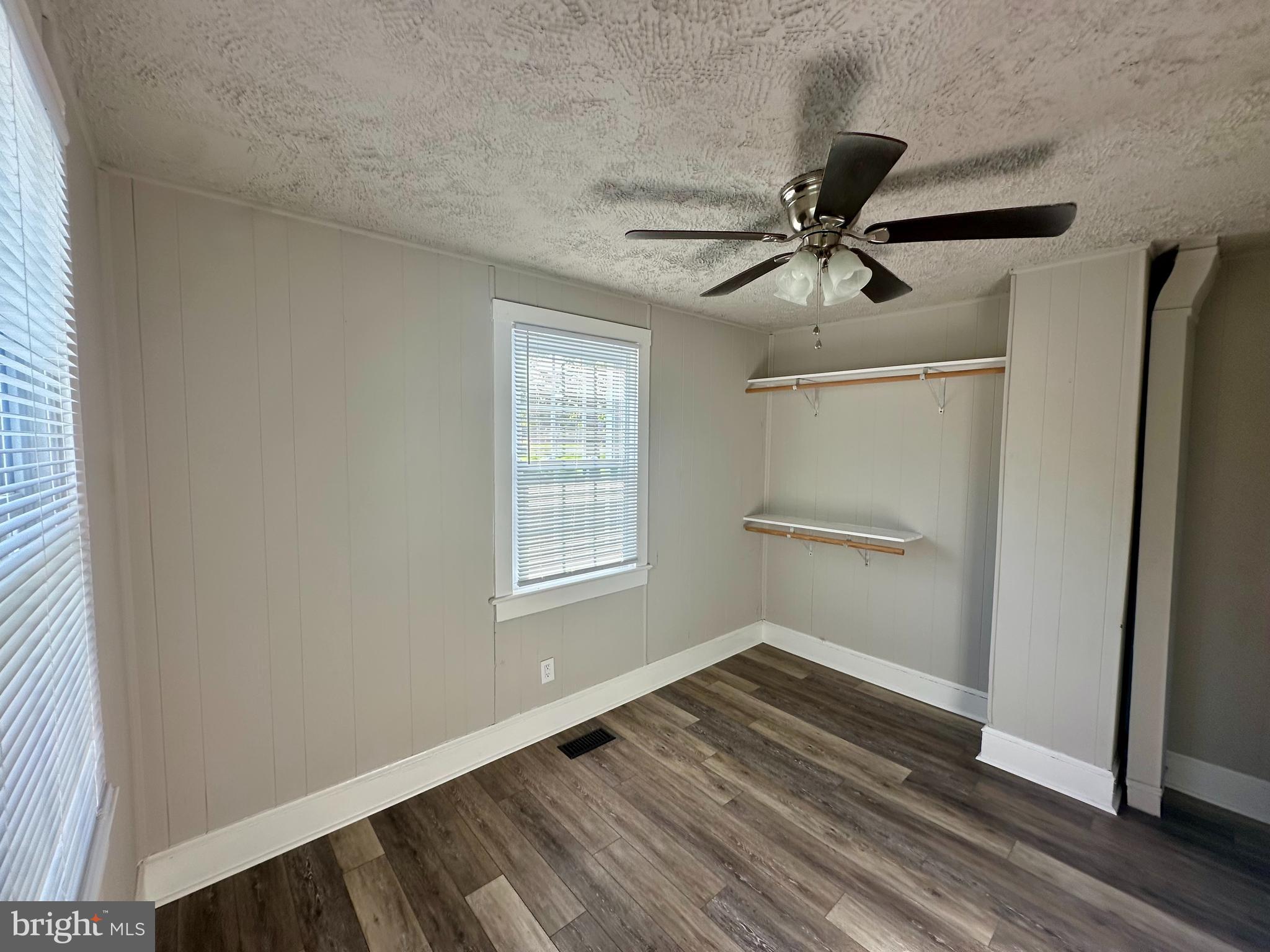 16142 Brandy Road Culpeper, VA 22701 - Photo 15 of 21 a view of empty room with wooden floor and fan