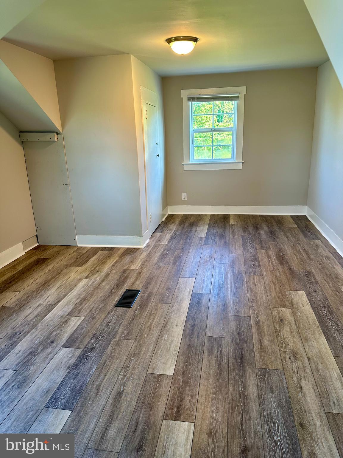 16142 Brandy Road Culpeper, VA 22701 - Photo 16 of 21 an empty room with wooden floor and windows