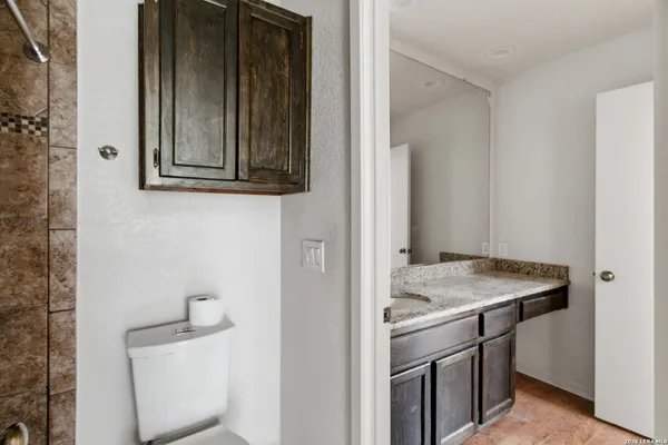 a bathroom with a sink and vanity