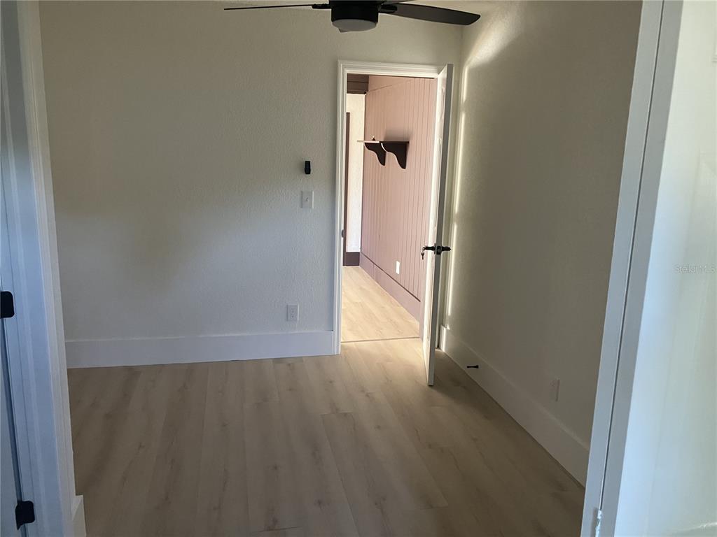 11630 79th Avenue Seminole, FL 33772 - Photo 13 of 14 a view of a hallway with wooden floor