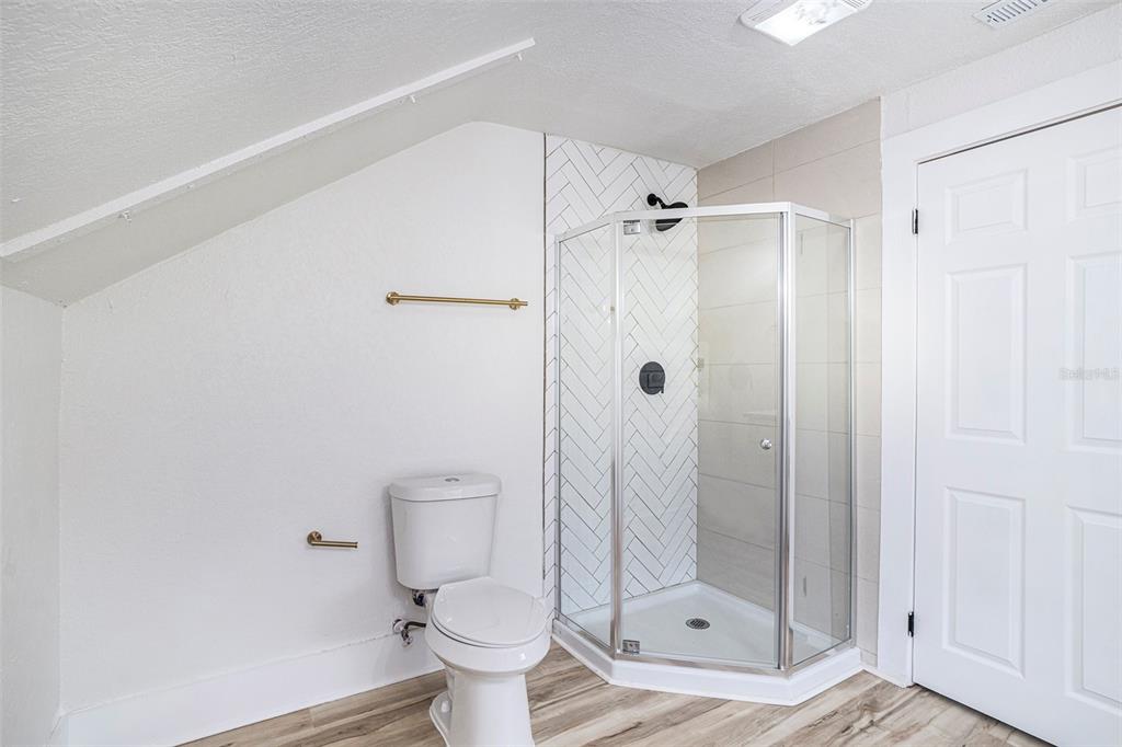 11630 79th Avenue Seminole, FL 33772 - Photo 3 of 14 a bathroom with a toilet and a shower