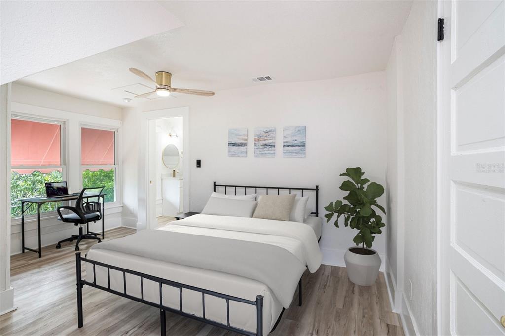 11630 79th Avenue Seminole, FL 33772 - Photo 4 of 14 a bed sitting in a spacious bedroom next to a window