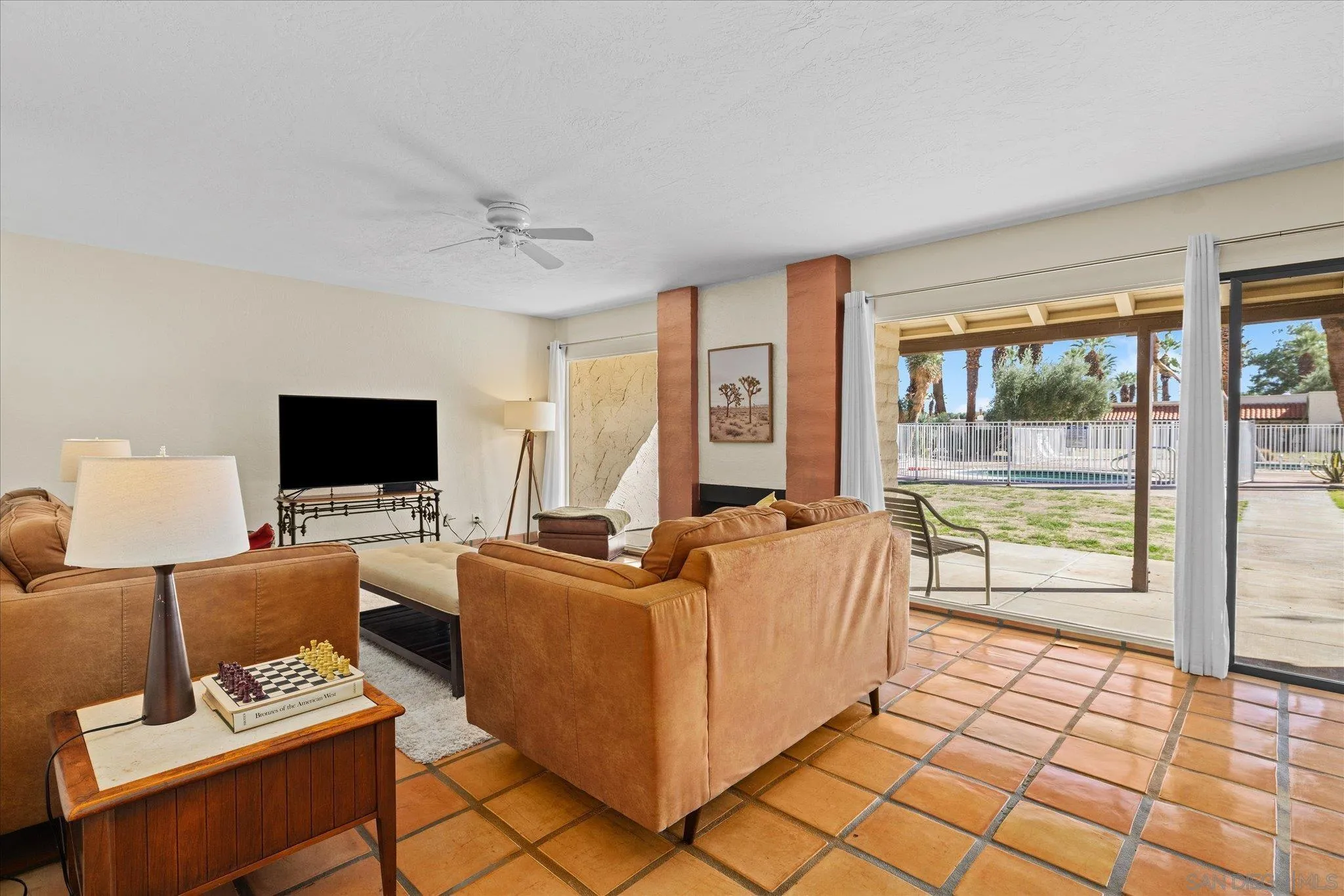 1668 Montezuma Court, Unit 22 Borrego Springs, CA 92004 - Photo 19 of 75 a living room with furniture and a flat screen tv
