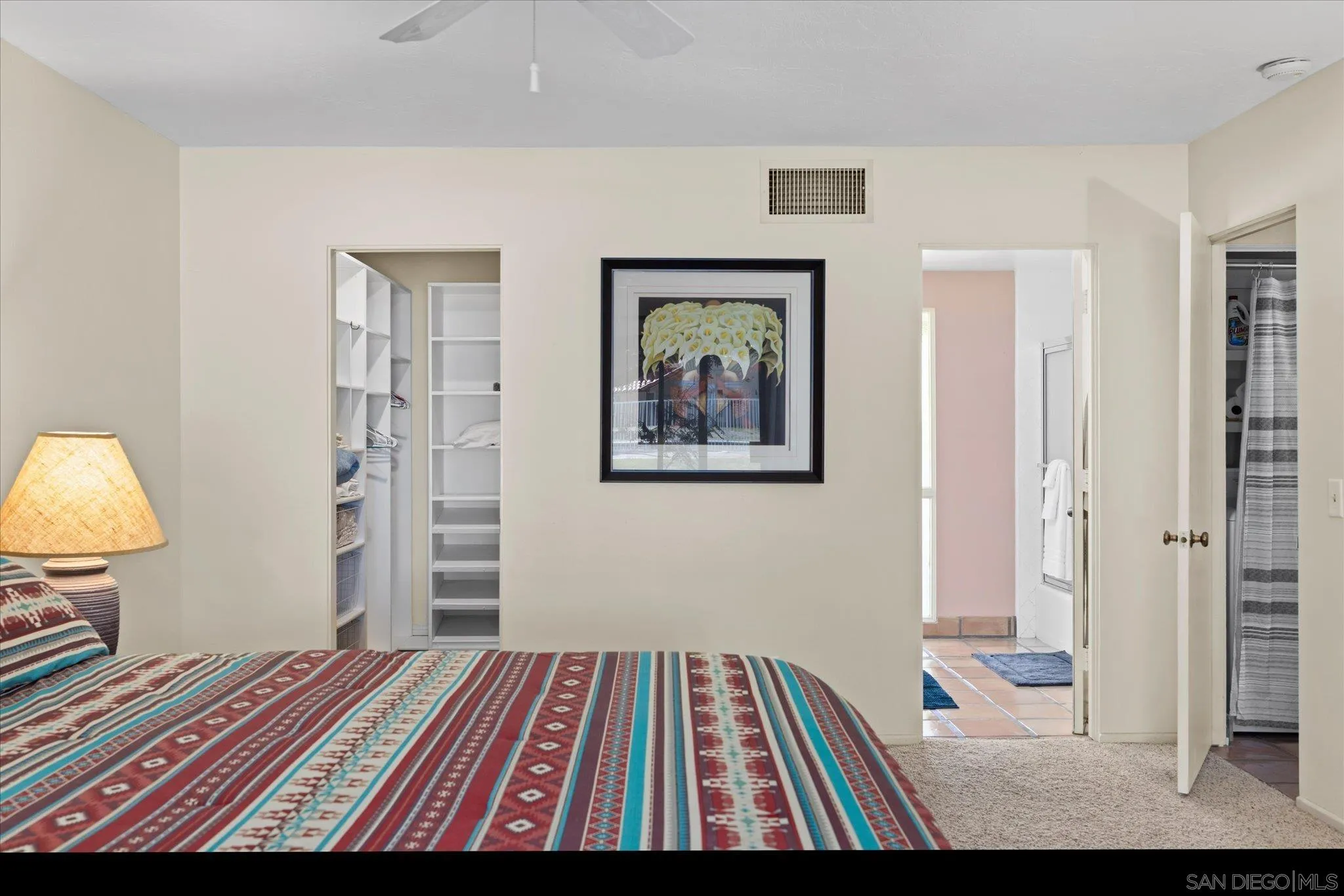 1668 Montezuma Court, Unit 22 Borrego Springs, CA 92004 - Photo 2 of 75 a bedroom with a bed and a lamp on dresser