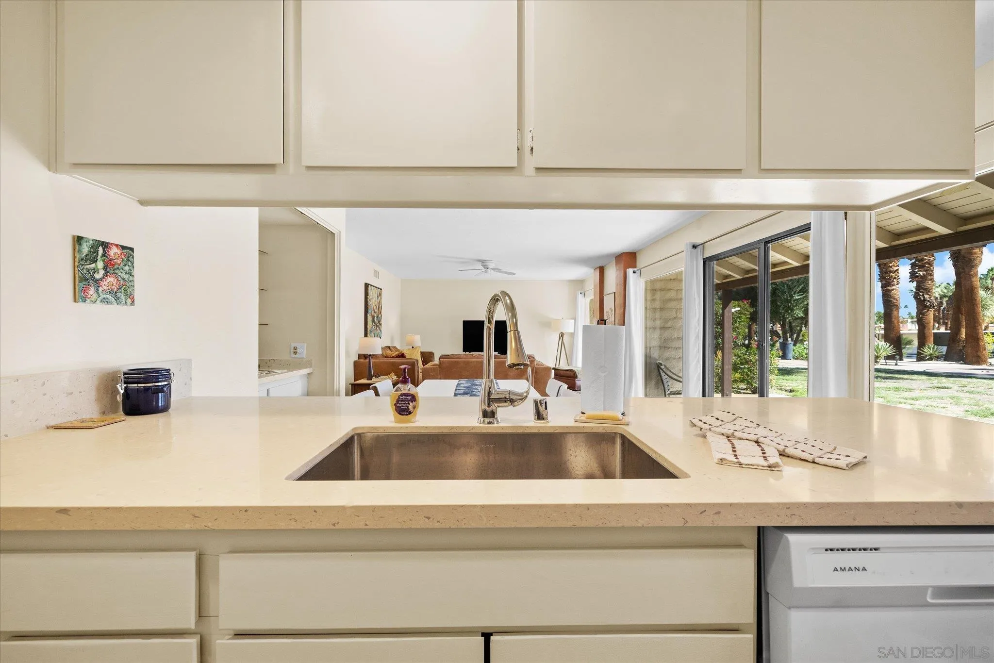 1668 Montezuma Court, Unit 22 Borrego Springs, CA 92004 - Photo 23 of 75 a kitchen with kitchen island a sink a stove and white cabinets