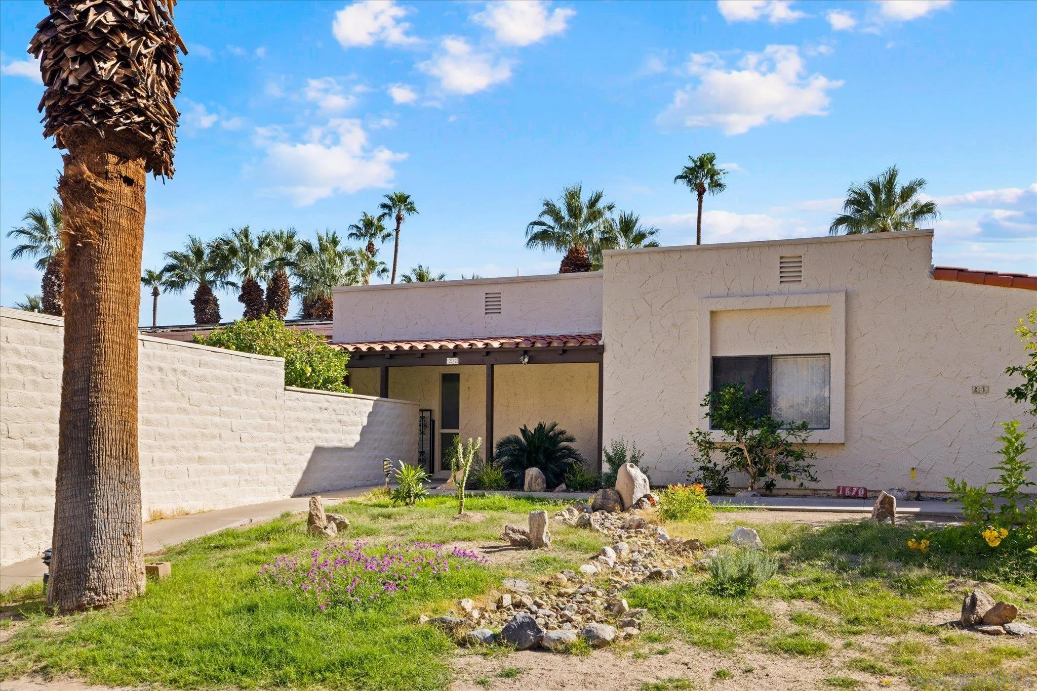 1668 Montezuma Court, Unit 22 Borrego Springs, CA 92004 - Photo 30 of 75 a front view of a house with a yard