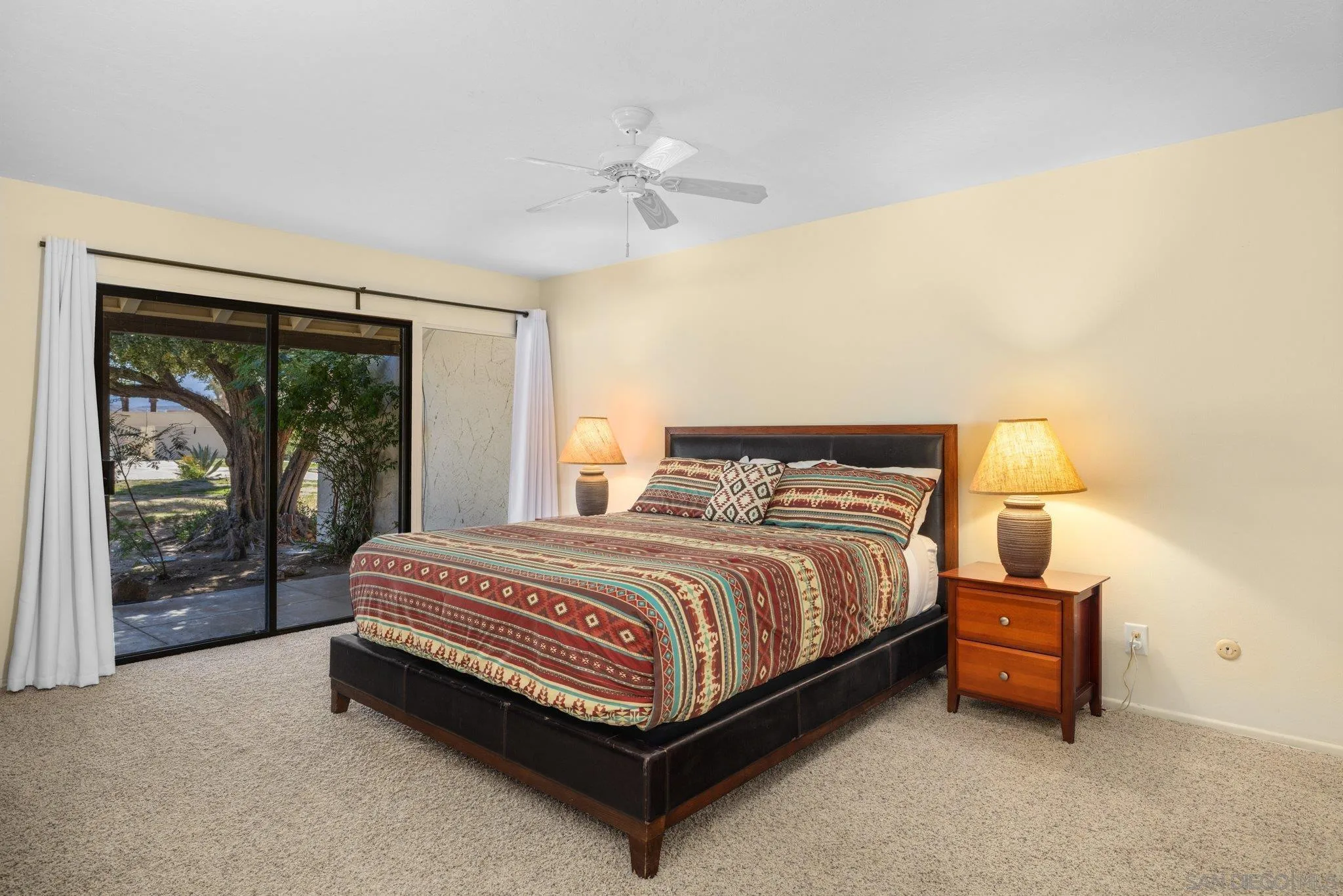 1668 Montezuma Court, Unit 22 Borrego Springs, CA 92004 - Photo 3 of 75 a spacious bedroom with a bed and large window