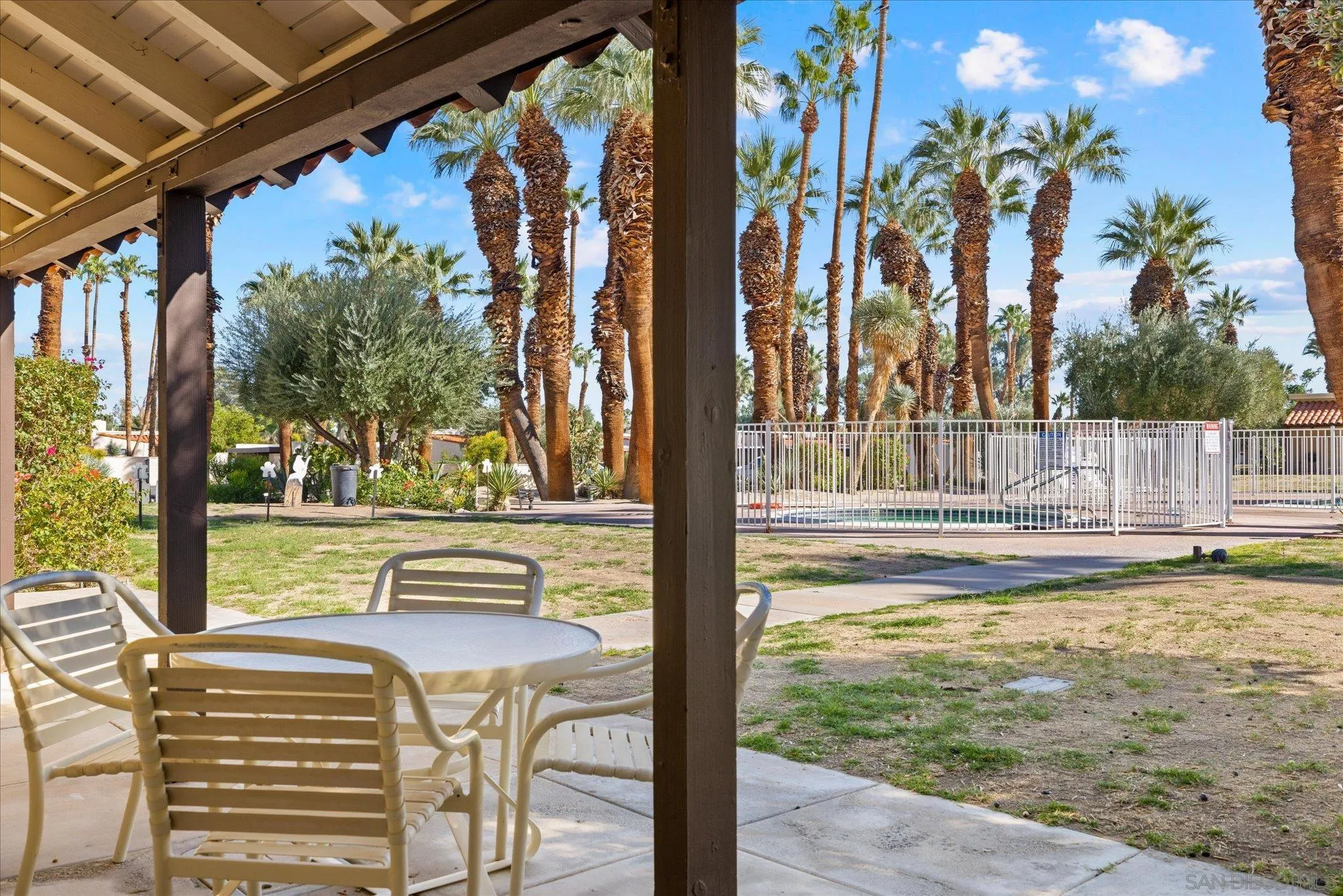 1668 Montezuma Court, Unit 22 Borrego Springs, CA 92004 - Photo 32 of 75 a view of swimming pool with lawn chairs and plants