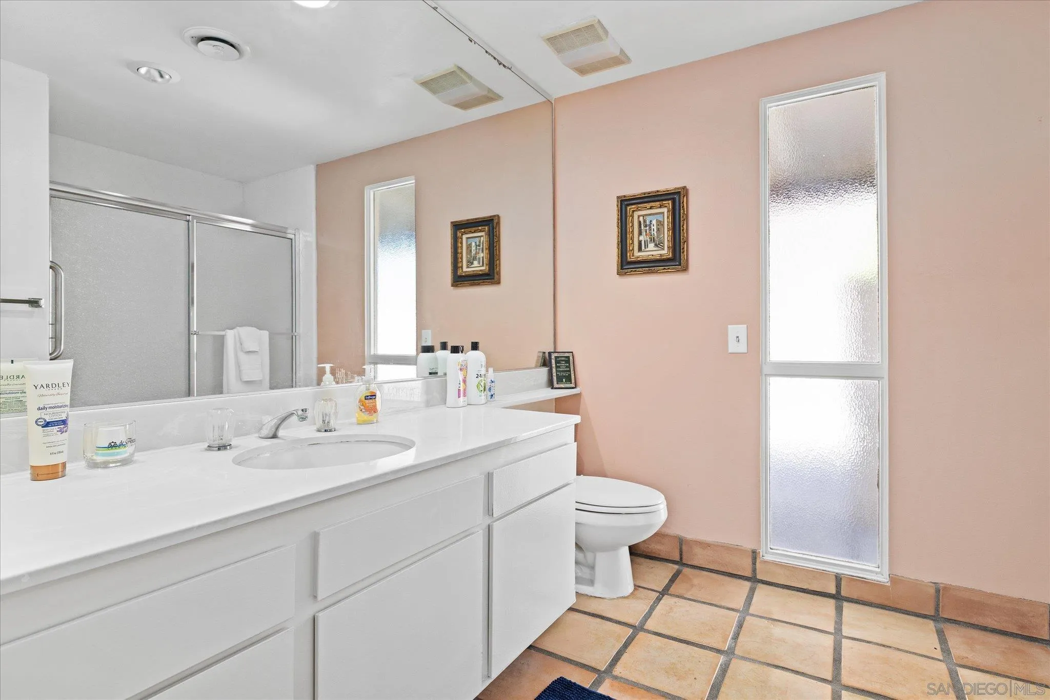 1668 Montezuma Court, Unit 22 Borrego Springs, CA 92004 - Photo 7 of 75 a bathroom with a sink a toilet a mirror and vanity