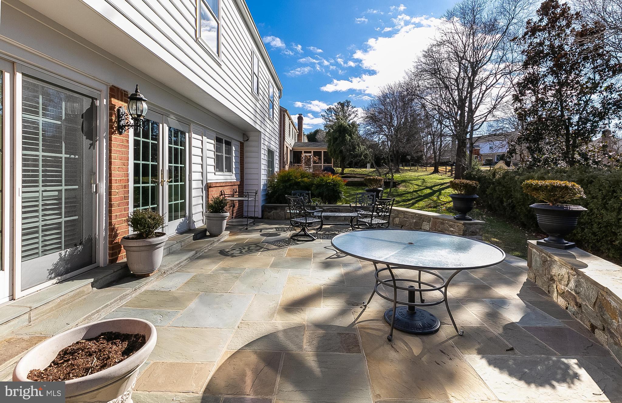 12812 Deep Spring Drive Potomac, MD 20854 - Photo 11 of 33 Flagstone Patio off Kitchen