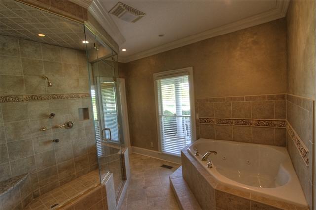3334 Armstrong Valley Road Murfreesboro, TN 37128 - Photo 13 of 19 a bathroom with a tub a toilet and a shower