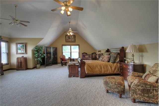 3334 Armstrong Valley Road Murfreesboro, TN 37128 - Photo 14 of 19 a spacious bedroom with a bed and a chandelier