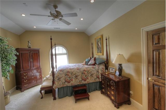 3334 Armstrong Valley Road Murfreesboro, TN 37128 - Photo 16 of 19 a bedroom with furniture a bed and a chandelier