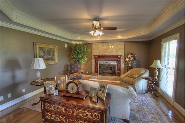 3334 Armstrong Valley Road Murfreesboro, TN 37128 - Photo 5 of 19 a living room with furniture a fireplace and a flat screen tv